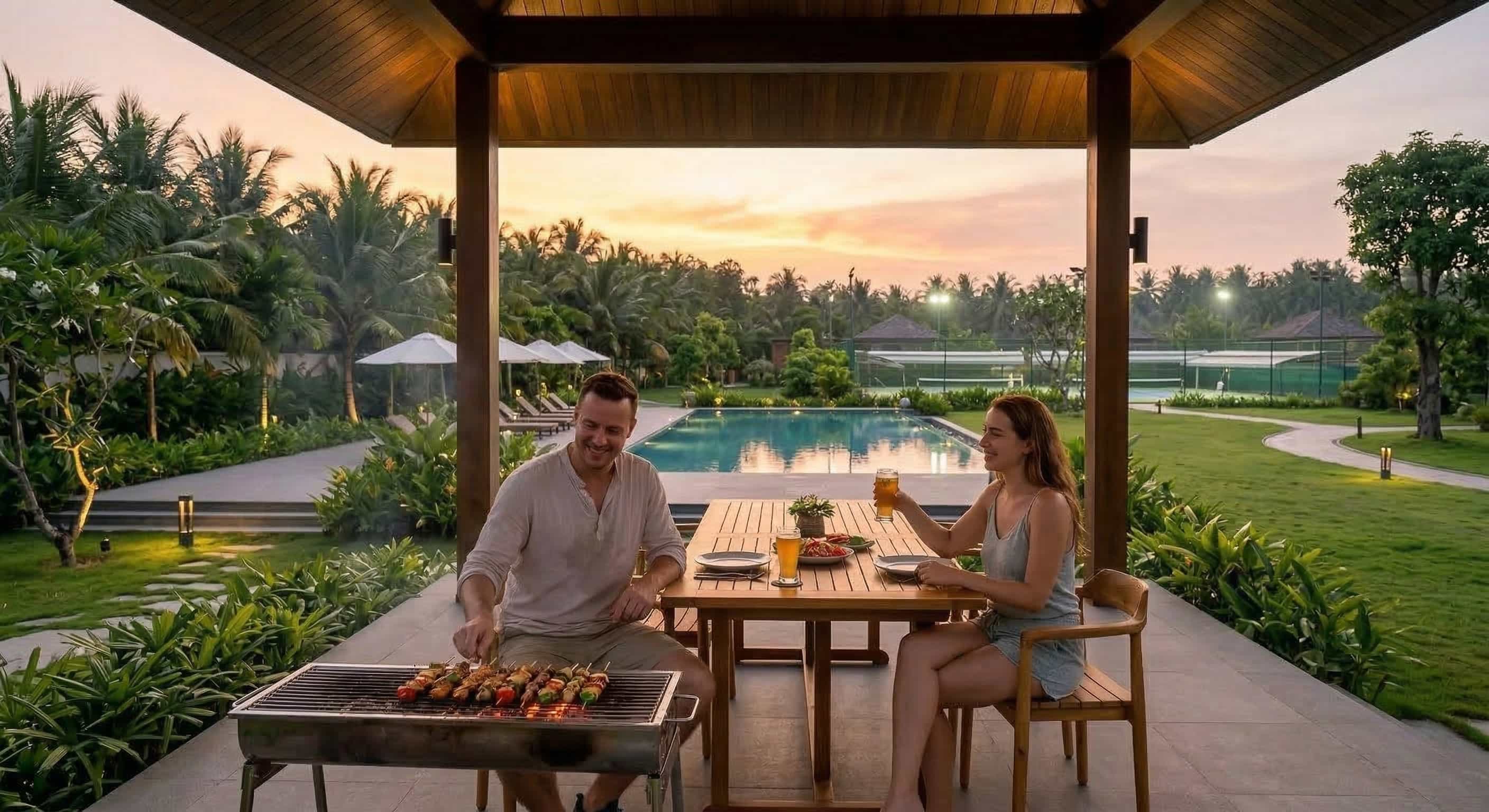 A shared barbecue dinner at sunset